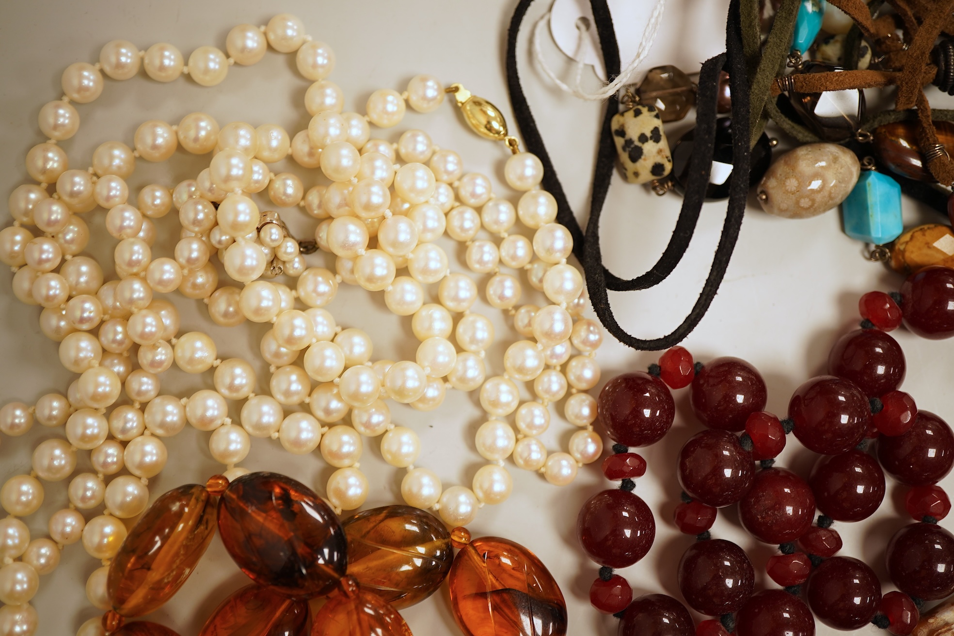 A collection of cultured pearls and hardstone jewellery, comprising: a cultured pearl necklace with a cultured pearl and diamond clasp in 18ct gold, length 46cm, British hallmarks; a cultured pearl necklace with a gold b